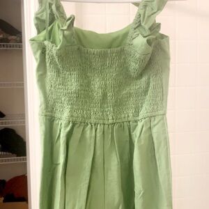 sage green jumpsuit with frills on sleeves